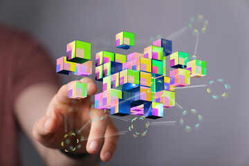 Abstract hand touching connected cubes, representing data, network, digital, technology and future. Connection