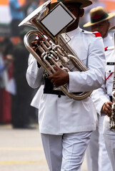 Close-up a bagpiper is blowing bugle