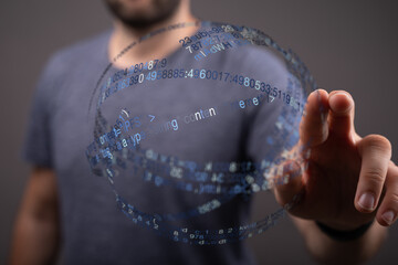 Abstract image of a person touching a virtual display with digital data. Concepts include technology, innovation, and futuristic user