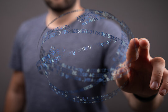 Abstract image of a person touching a virtual display with digital data. Concepts include technology, innovation, and futuristic user