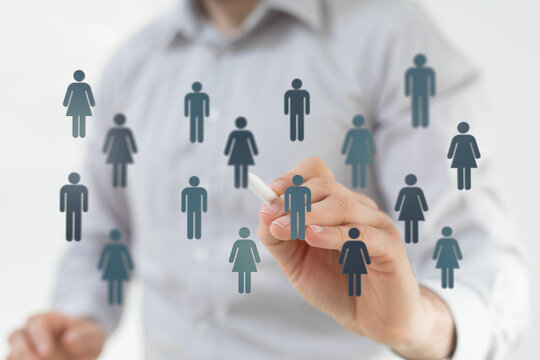 Concept image of a person drawing icons representing people on a screen with networking, teamwork, and business - Powered by Adobe