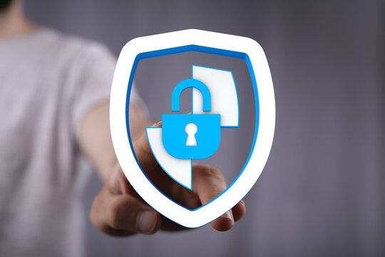 Secure digital data concept with person holding shield icon with security lock, data protection, privacy, internet security, and onli