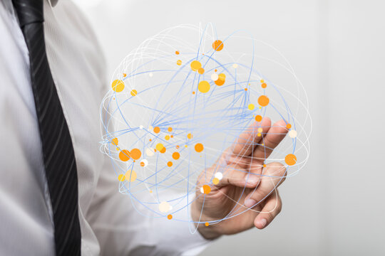 A man in a suit holds a digital network globe, symbolizing global communication, connection, and technology. Ideal for business, IT,