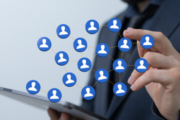 Close up shot of a businessman holding a digital network of people, representing connection and...