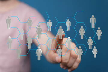 Hand interacting with a virtual social network interface. Represents communication, connection, technology and community.