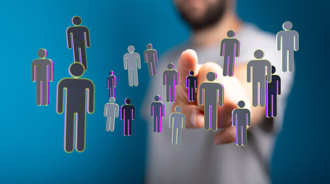 Businessman touching a holographic human network. Concept of business, people, technology, and communication. Symbolizing teamwork and digital s - Powered by Adobe