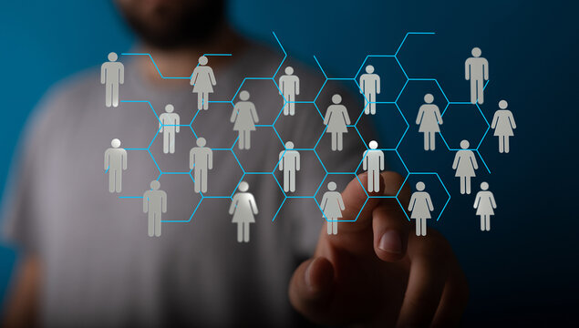 Abstract network of people linked together for communication or social media concept. The hand indicates interaction, connectivity, and business