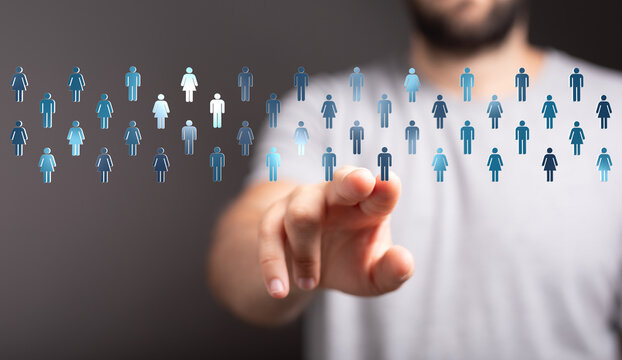Abstract image of hand pointing to digital people icons, representing concepts of community and connection. Suitable for business, social, or ne