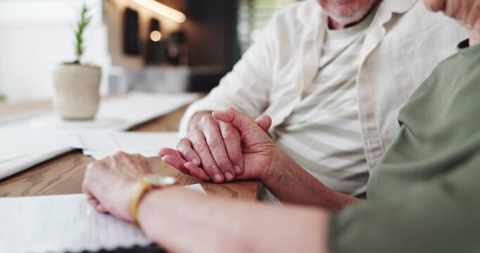 Home, holding hands and old couple with documents, financial insurance and budget. Apartment, closeup and man with woman, paperwork and support with audit, tax and comfort with will and accounting