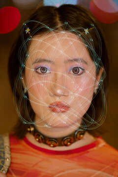 Young woman with digital graphics over face, wearing colorful top and choker necklace. Shanghai, China