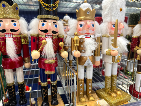 Christmas tin soldiers lined up on store shelf.
