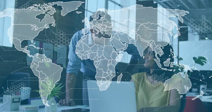Team leaning, pointing at laptop, starting world map expanding with hex nodes, discussing business