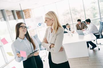 Professional office colleagues engaging in teamwork collaboration during a business project meeting with diverse employees