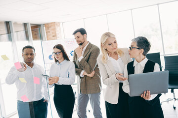 Team collaboration in an office setting, diverse colleagues sharing ideas and strategies for growth and success