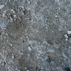 Close-up of a gray-black lava texture on the ground. Porous, cracked, and stony, perfect as a stock texture or photo background. Impression of molten rock.