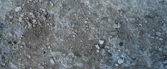 Close-up of a gray-black lava texture on the ground. Porous, cracked, and stony, perfect as a stock...