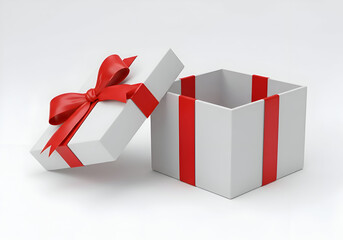 White gift box with red ribbon bow open on a plain white surface. Opened gift box with red ribbon detailing on a plain background.
