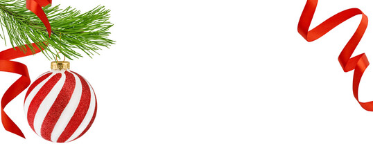 Christmas ornament round red ball red white hanging from fir tree branch and satin ribbon isolated with empty space for text isolated on white background with clipping path. Design element. Banner.