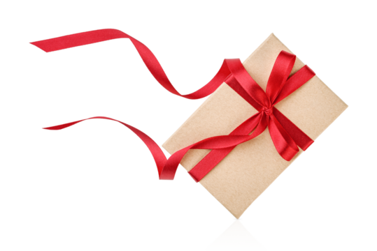 Christmas gift box wrapped in paper and decorated with red ribbon and bow isolated on white background with clipping path. Christmas, Valentines Day or Birthday celebration themes. Design element.