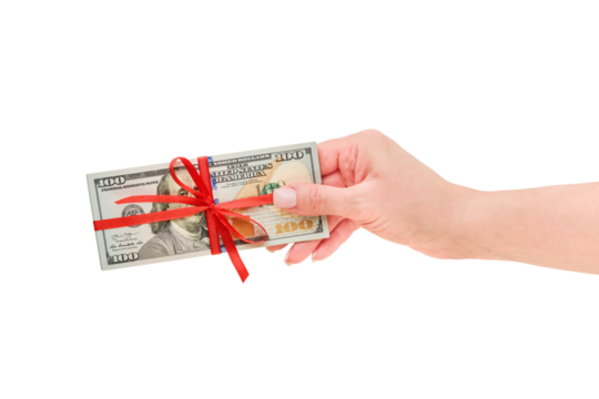 Female hand hold US dollar money cash stack with red ribbon and bow isolated in white background with clipping path. Design element. American Dollars gift money as a gift, win or bonus concept.