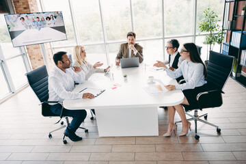 Professional business team collaborating in a modern office environment for project development and company achievements