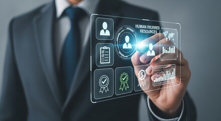 Businessman interacting with futuristic holographic interface displaying employee data and analytics for human resources