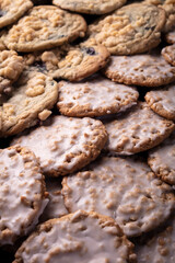 A large pile of delicious, freshly-made cookies with oatmeal and cinnamon glazed. 