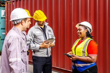 Group of engineer and foreman worker team in industry containers yard, inspecting containers box at shipping yard, Success teamwork, talking about work and project in factory workshop