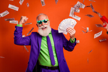 Bearded man in purple suit celebrates with cash in a colorful retro party vibe