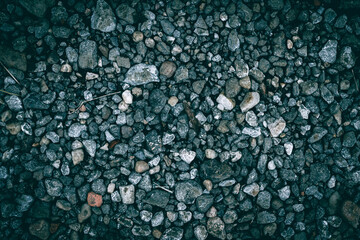 A close up of gray gravel small stones texture pattern