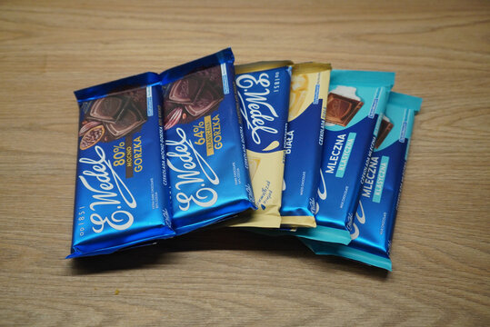 E. Wedel chocolate bars in various flavors on a wooden surface