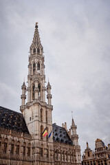 Brussels Town Hall tower in Grand Place, Belgium on a cloudy day
