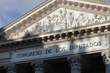 Classical-style facade of the Congress of Deputies building in Madrid, capital of Spain, on a sunny...