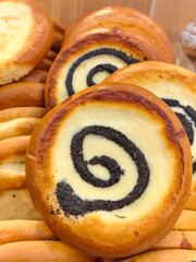 Delicious pastry swirl with poppy seeds on a bakery display