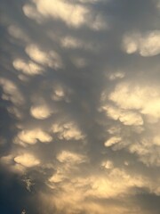 Mammatus clouds at sunset sky with pastel colors and dramatic tones  