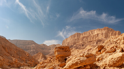 Stunning geological formations of White Canyon in Timna Park. Layered sandstone cliffs and eroded...