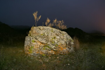 Russia. The South of Western Siberia, the Altai Mountains. Stone placers on an autumn moonlit night in the valley of the Katun mountain river near the village of Inya.
