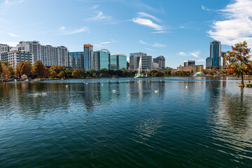 Amazing view of Orlando skyline in Florida and reflection in Lake Eola.