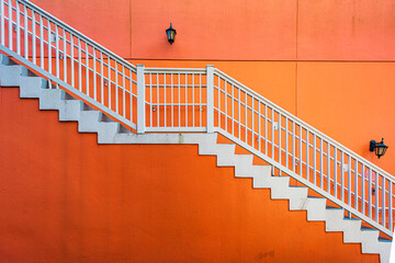 Orange wall with a white stairs in Orlando Florida.