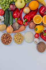 Set of basic healthy eating ingredients: vegetables, grains, and nuts with copy space