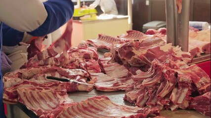 Display of fresh beef and veal cuts at a traditional market stall, featuring steaks, ribs, bone-in pieces and assorted raw meat varieties suitable for cooking, grilling and classic culinary recipes