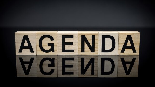 Agenda word on wooden blocks for planning meeting tasks schedule