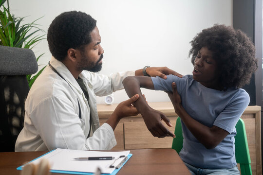 A Modern rehabilitation physiotherapy worker with woman client