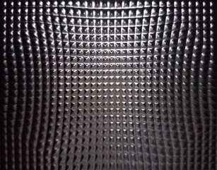 Glass with pyramides engraving background distorted