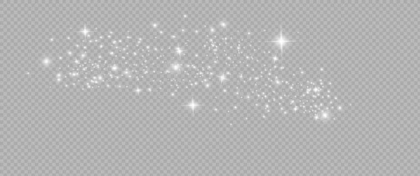 The dust sparks and white stars shine with special light. Vector sparkles on a transparent background. Christmas light effect.