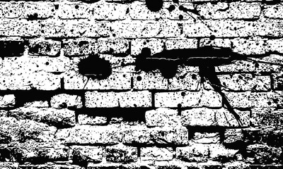 Distressed brick wall with black paint splatters.
