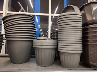 Plastic flower pots are sold at flower shop. Large flower pots in supermarket