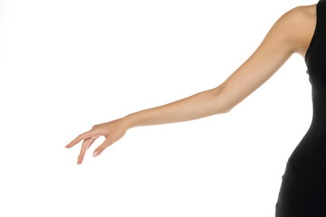 Studio close-up of elegant female arm in black sleeveless dress showing graceful hand gesture on white background.