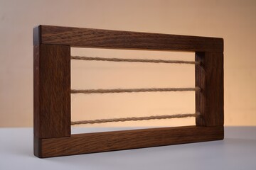Rustic wooden frame with horizontal ropes inside
