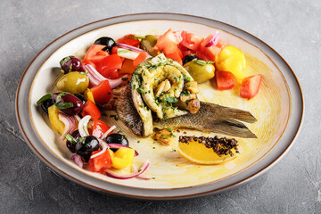 Bright mezze style plate with roasted vegetables and hummus